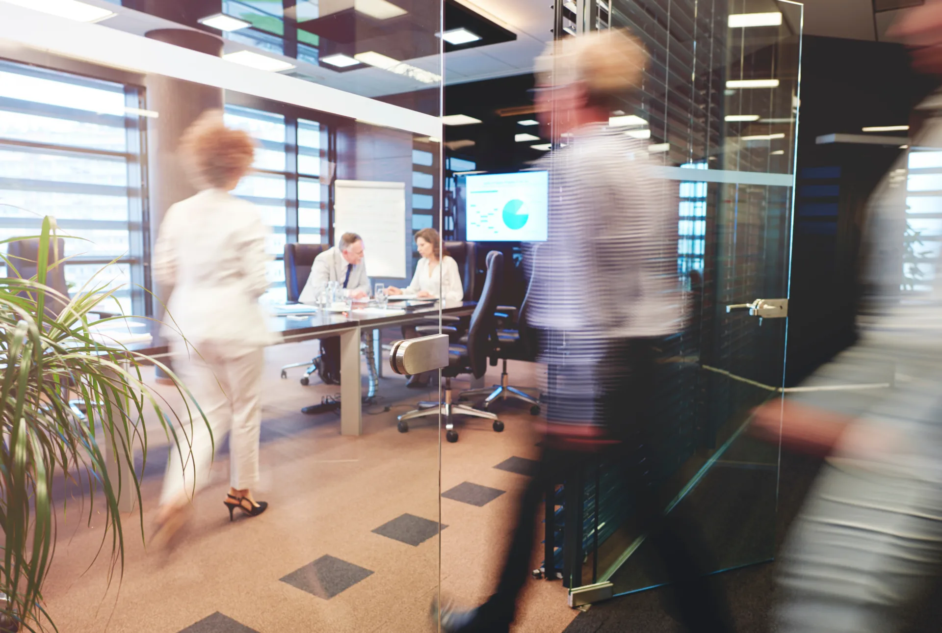defocused shot of business people in company